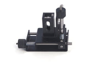 Adjustable cell holder for micro cuvettes by Sper Scientific, made of black metal with silver adjusters.