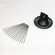 Bird spike and debris screen kit by Davis Instruments, with several metal rods next to black plastic drain cover.
