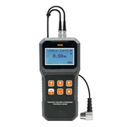 Gray ultrasonic thickness gauge by BRK, displaying a digital reading with connected probe cables.
