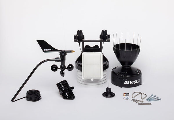 Black cabled Vantage Pro2 Plus Sensor Suite Weather Station by Davis Instruments, with solar panel, rain collector, and anemometer parts.