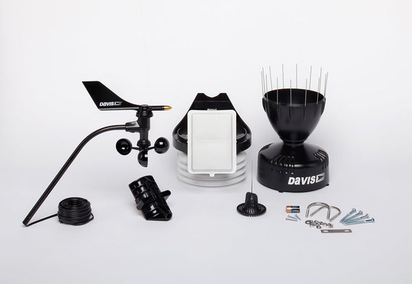 Black cabled sensor suite weather station by Davis Instruments featuring a solar panel and rain collector.