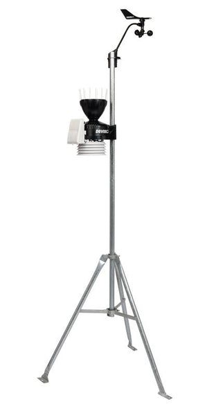 Weather station by Davis Instruments with wind vane, rain collector, and temperature sensors atop a galvanized tripod.
