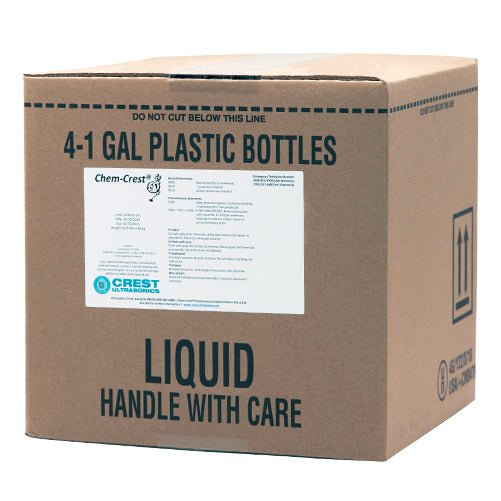 Case of four one-gallon bottles of ultrasonic cleaner solution by Crest Ultrasonics, packaged in a cardboard box with hazard labels.
