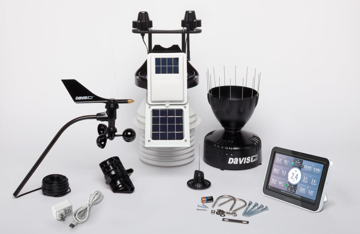 Professional weather station with fan aspirated radiation shield by Davis Instruments, including wind vane, rain collector, and LCD console.
