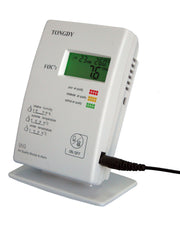 White air quality monitor by Tongdy with a digital display showing indoor readings on a white stand.