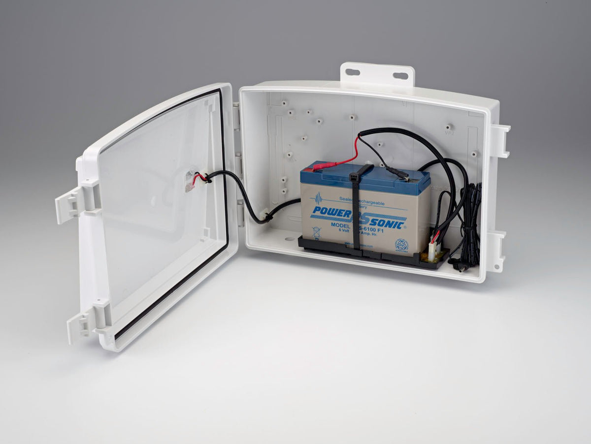 Heavy duty solar power kit by Davis Instruments, with a battery and wiring inside a white plastic case with an open door.
