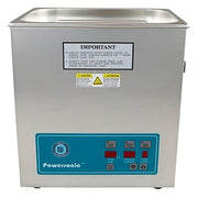 Benchtop ultrasonic cleaner by Crest Ultrasonics with a metallic finish and blue control panel.

