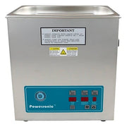 Stainless steel benchtop ultrasonic cleaner by Crest Ultrasonics, with control panel and warning labels.