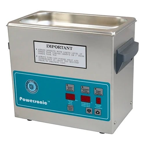 Stainless steel benchtop cleaner tank by Crest Ultrasonics with a control panel and small gray handles.