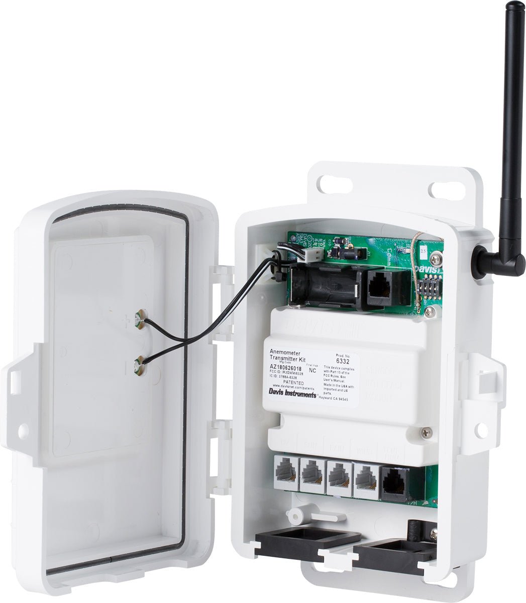 White solar-powered sensor transmitter by Davis Instruments, with an open door and an antenna.