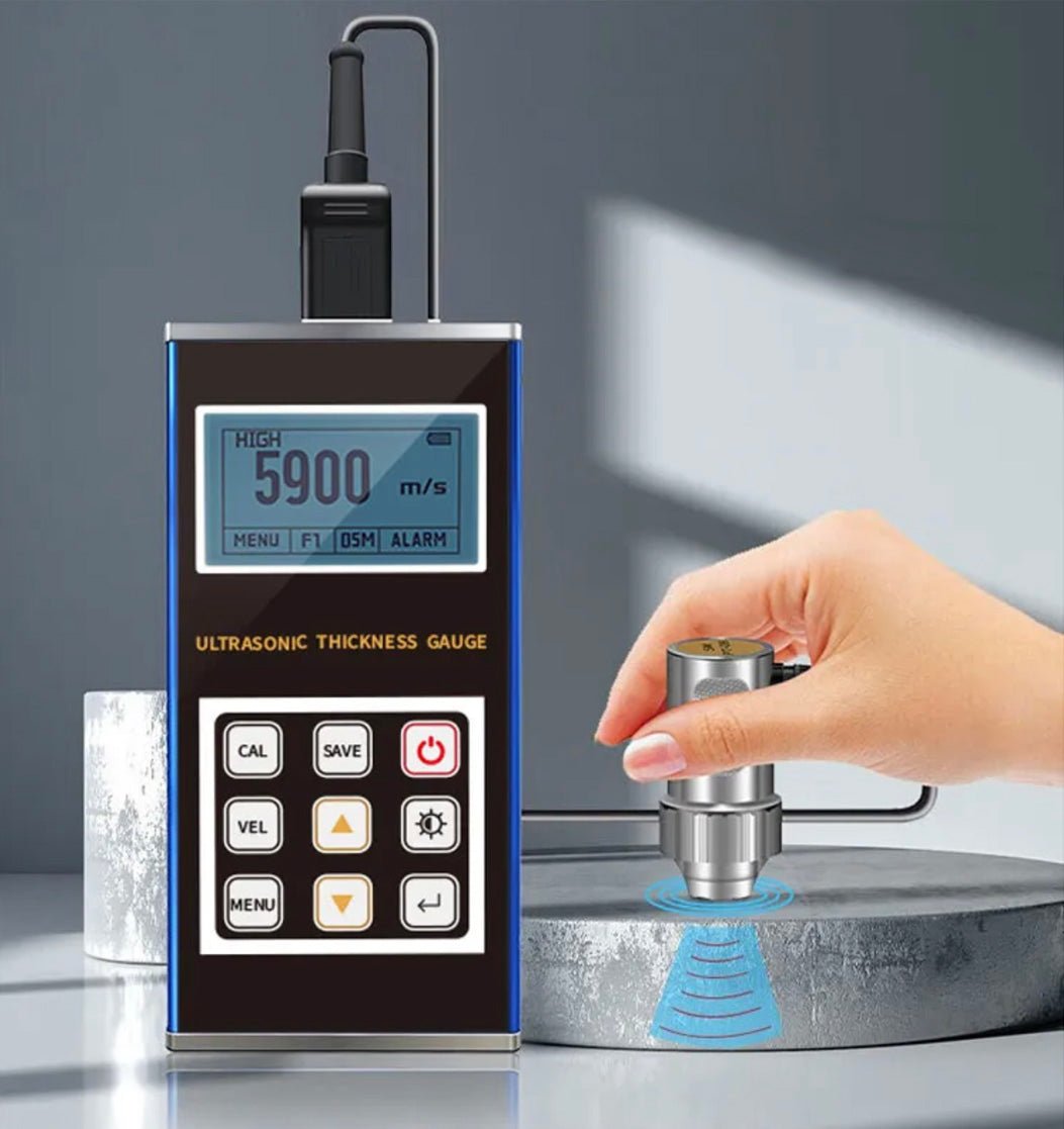 Ultrasonic thickness gauge by BRK, connected to a probe being used on a grey cylinder.