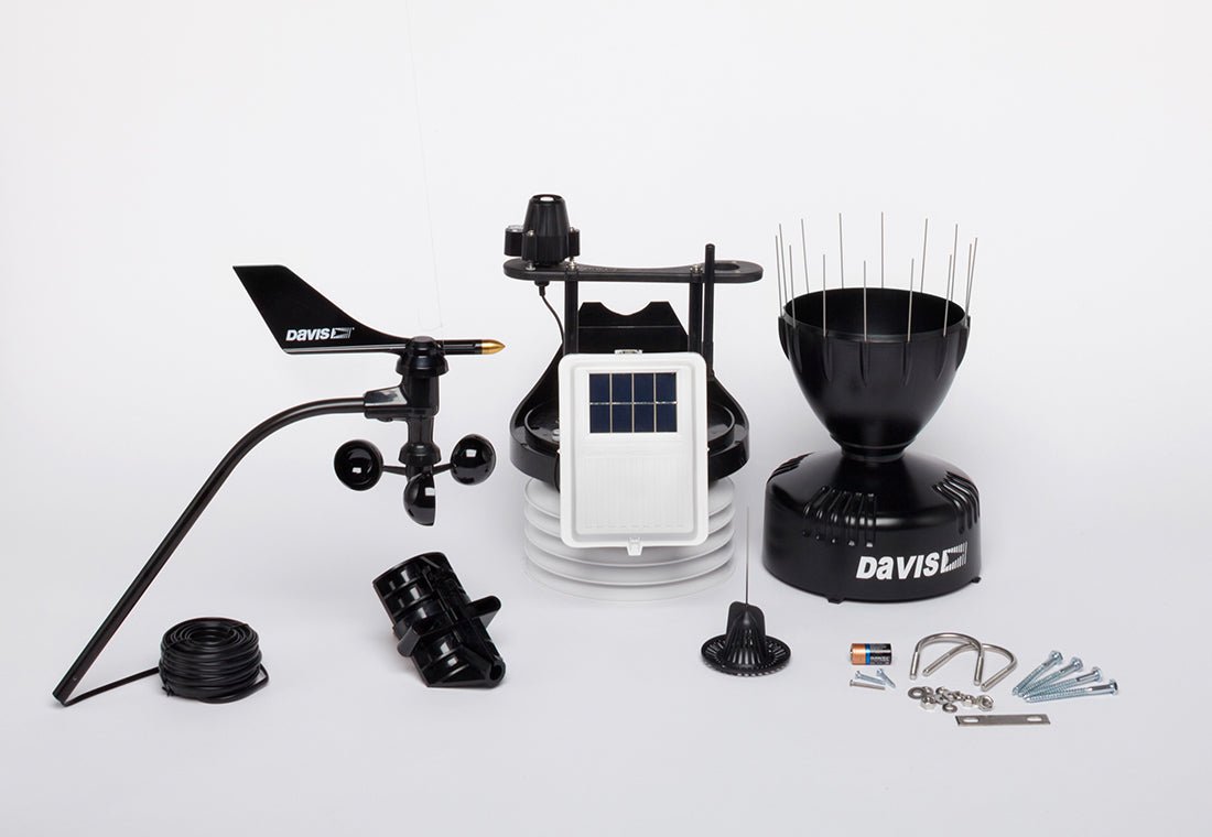 Black wireless sensor suite weather station by Davis Instruments, including a anemometer, rain collector, and solar power sensor.
