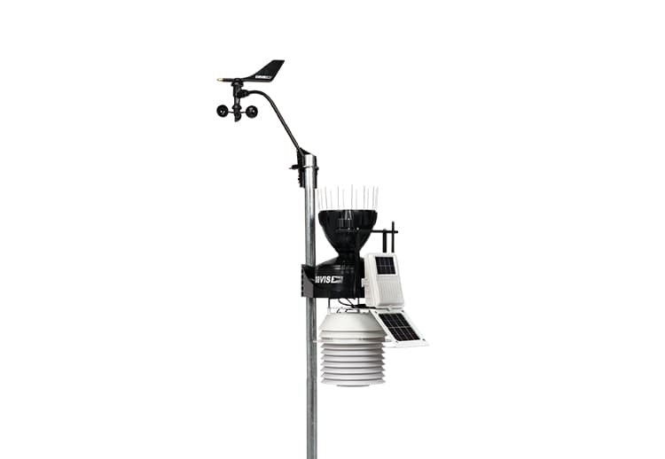 Wireless sensor suite weather station with a fan-aspirated radiation shield by Davis Instruments, mounted on a pole.