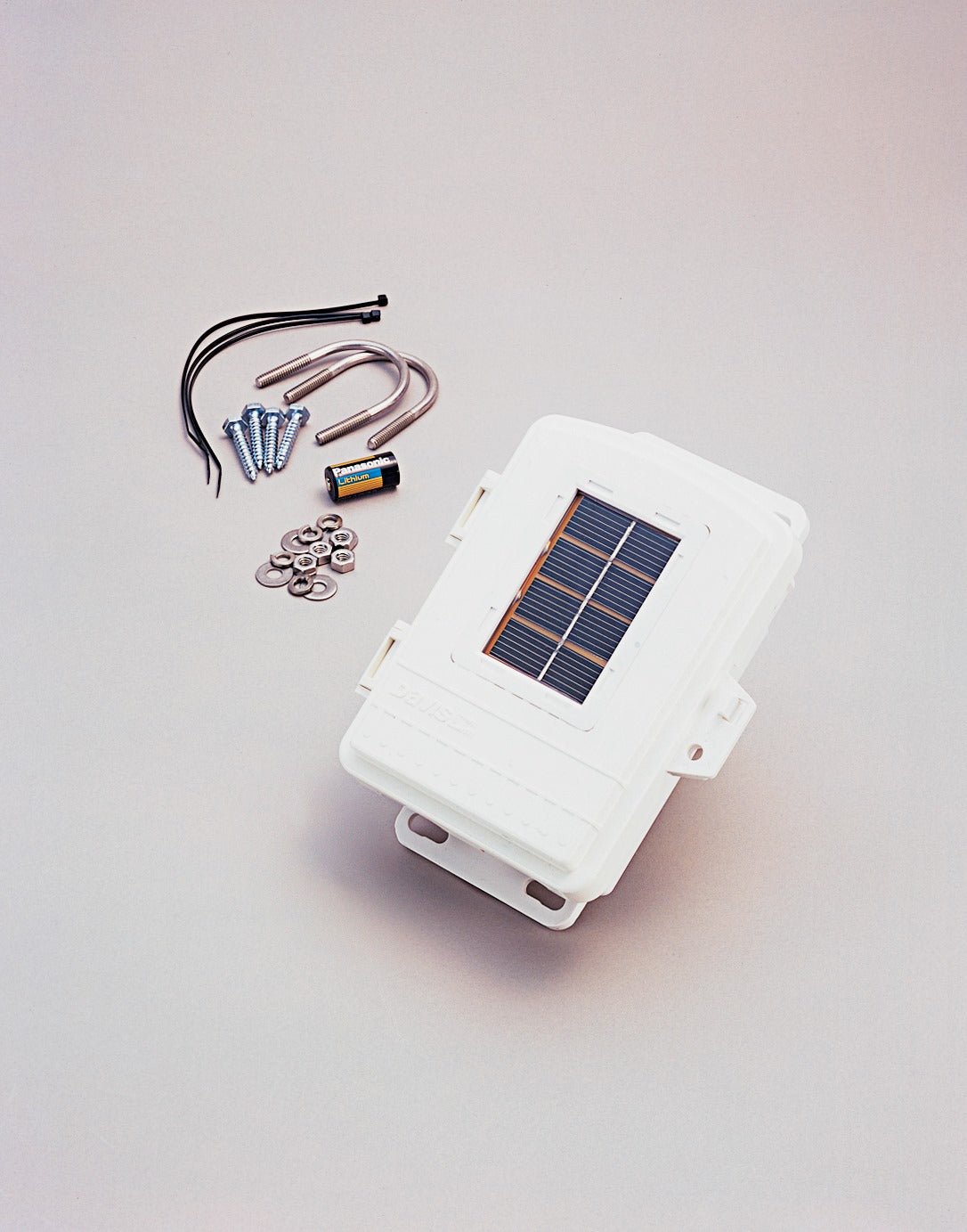 White, solar powered, wireless repeater by Davis Instruments including installation hardware and a lithium battery.