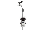 Wireless weather station by Davis Instruments with wind vane and solar panel on a metal pole.

