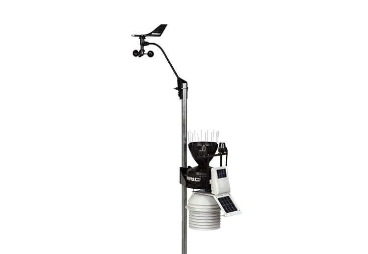 Wireless sensor suite weather station from Davis Instruments with a fan-aspirated radiation shield, mounted on a steel pole.