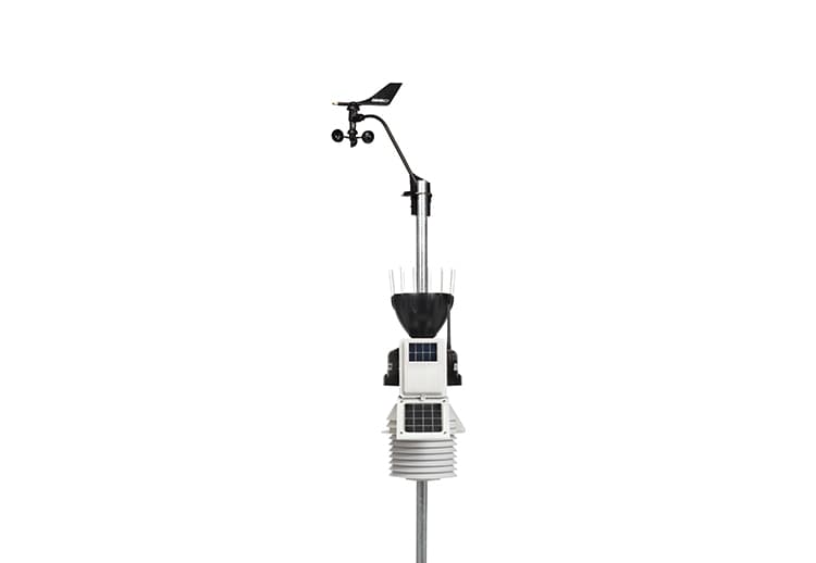 Wireless Vantage Pro2 sensor suite weather station with 24-hour fan, aspirated radiation shield by Davis Instruments, standing on a metal pole.